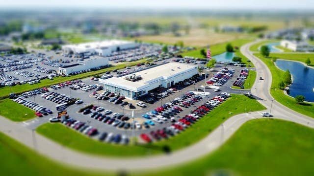 A view of a parking lot with cars parked in it.